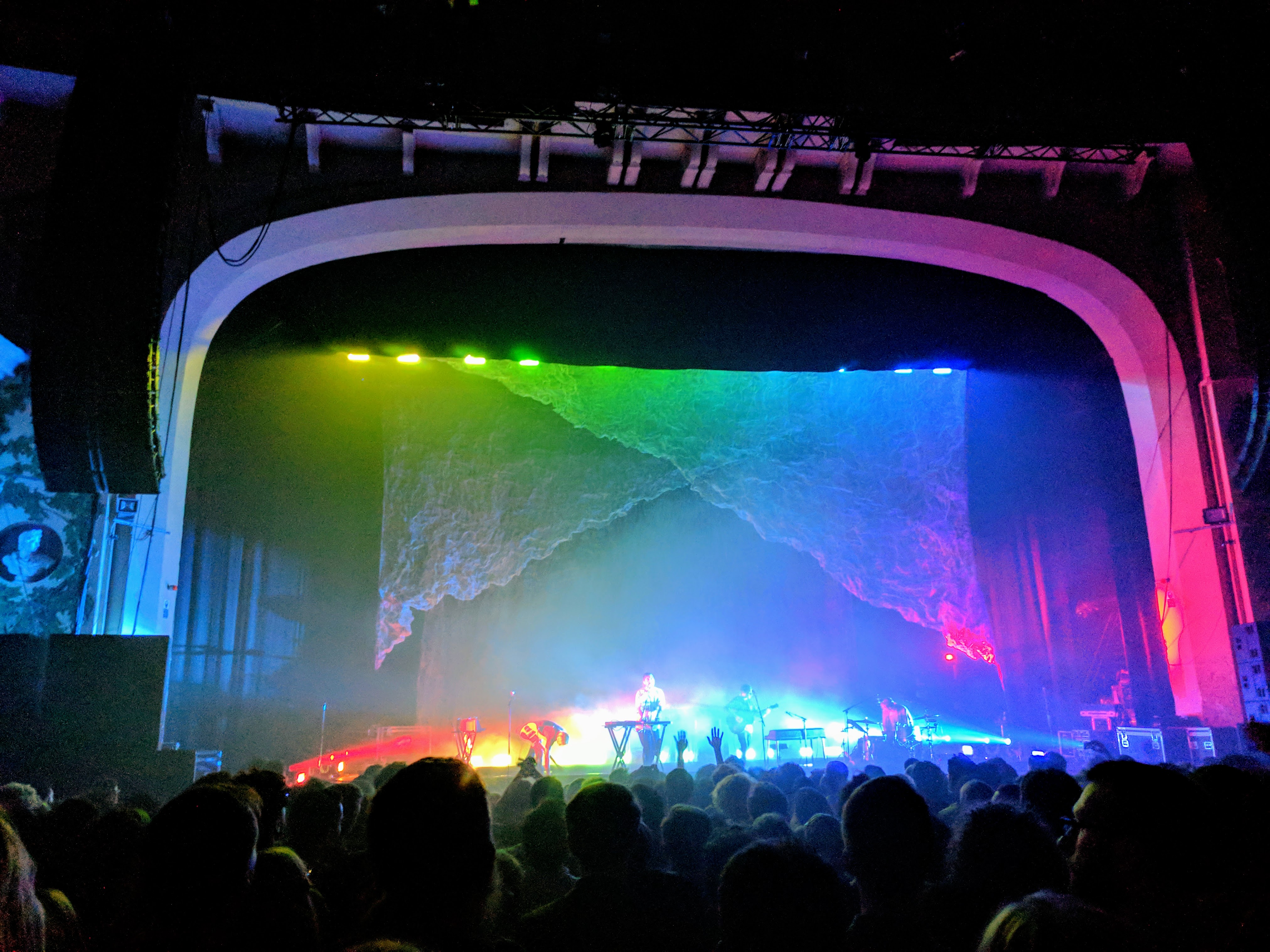 The stage at Brixton Academy lit up in rainbow. I don't remember who's playing at this point, it's difficult to make out.