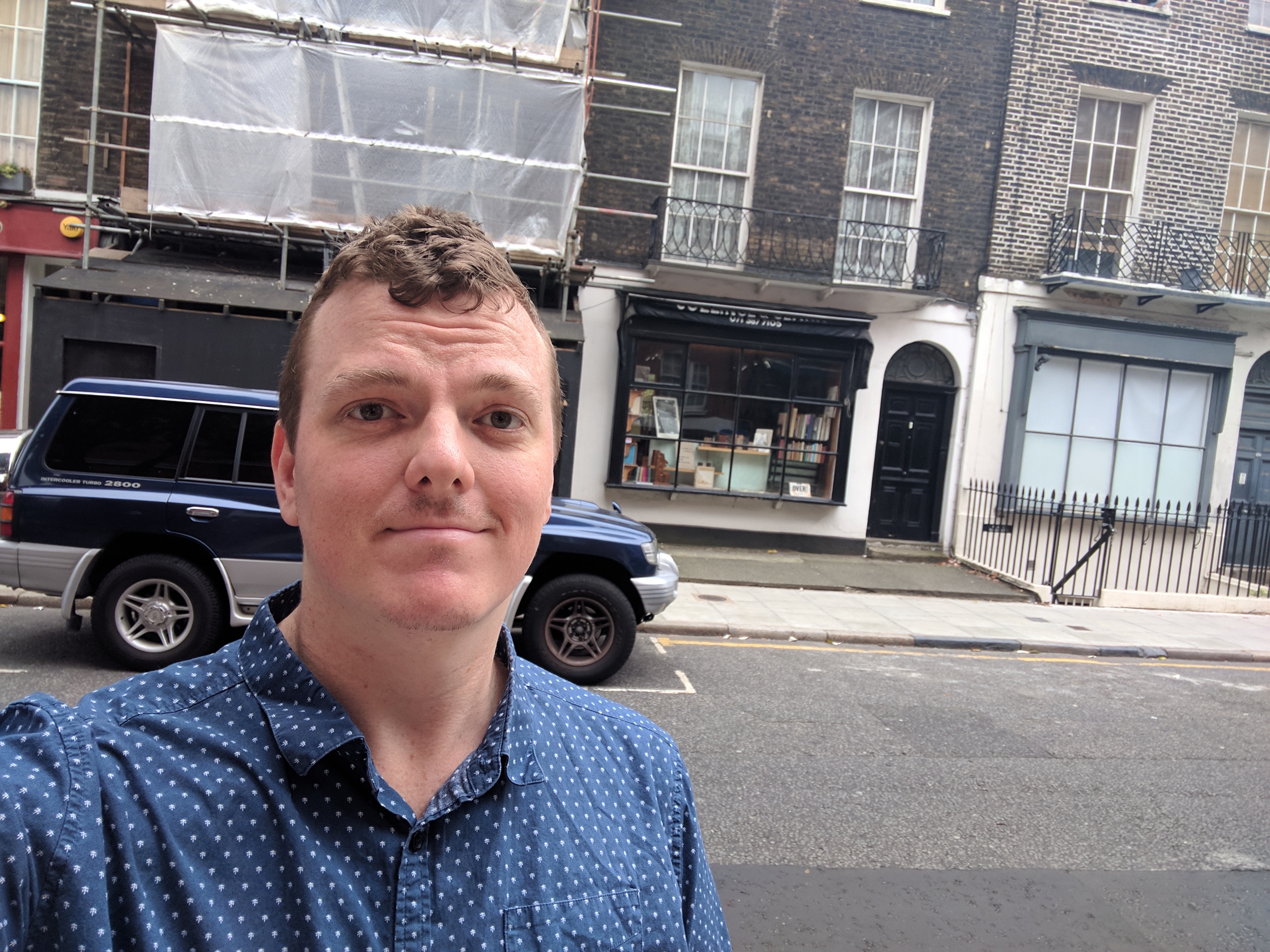 Me standing outside of Black Books and Nifty Gifty.