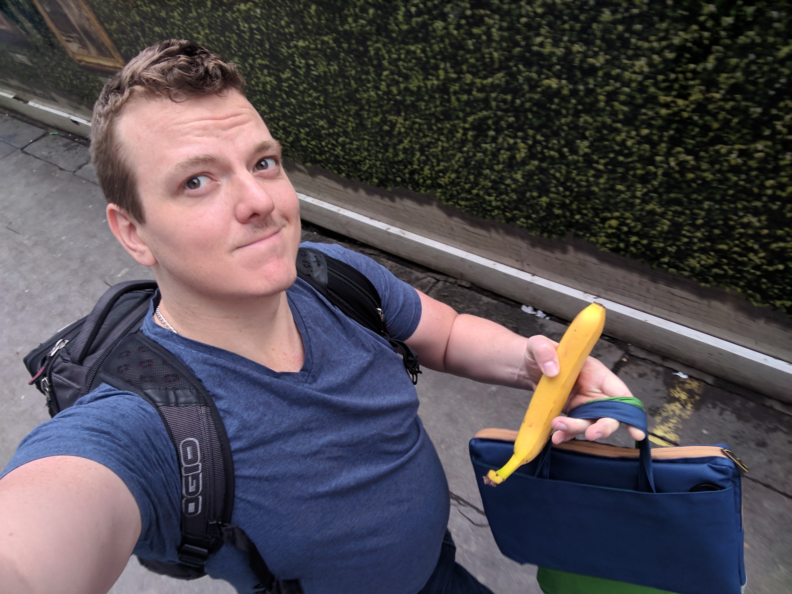 Me walking down the street, carrying all my bags plus a banana.