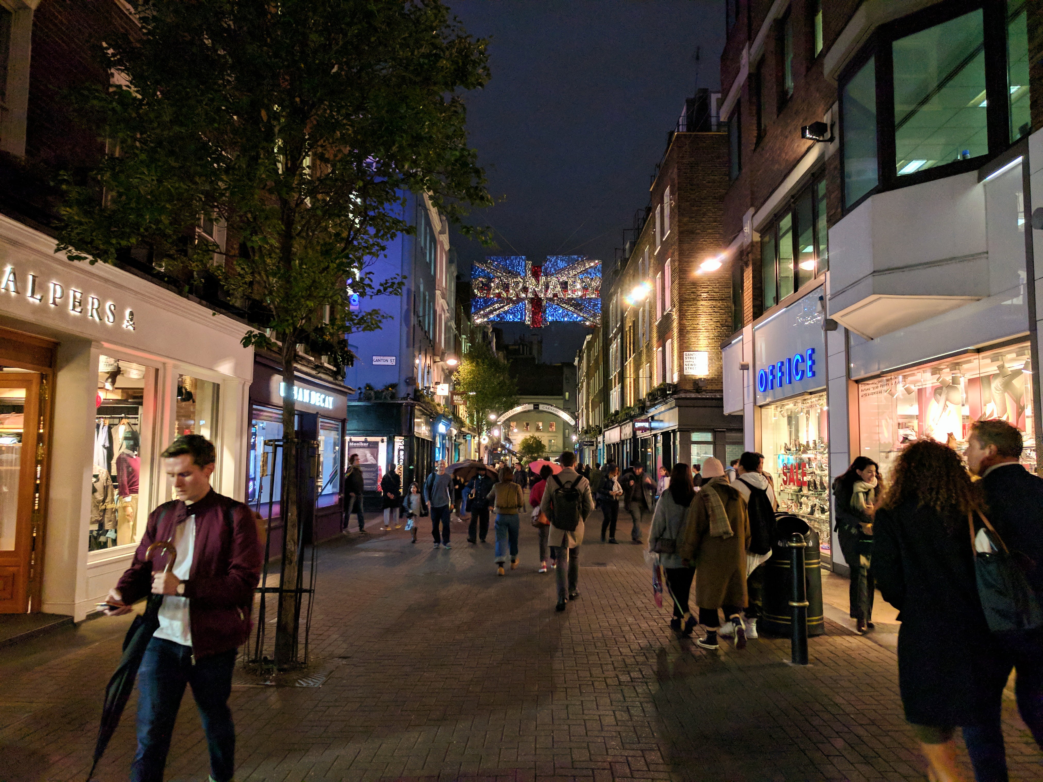 Busy london mall at night.