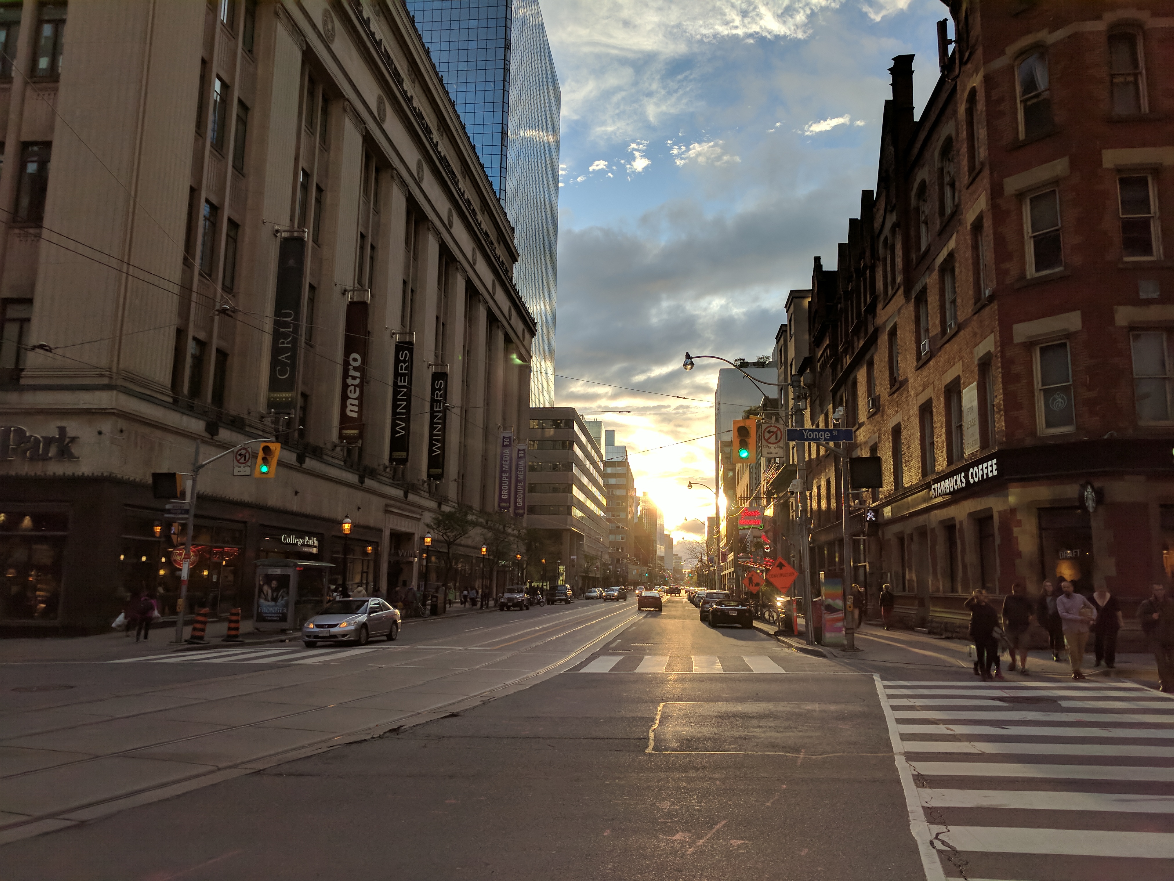Watching the sunset down a long downtown Toronto street.