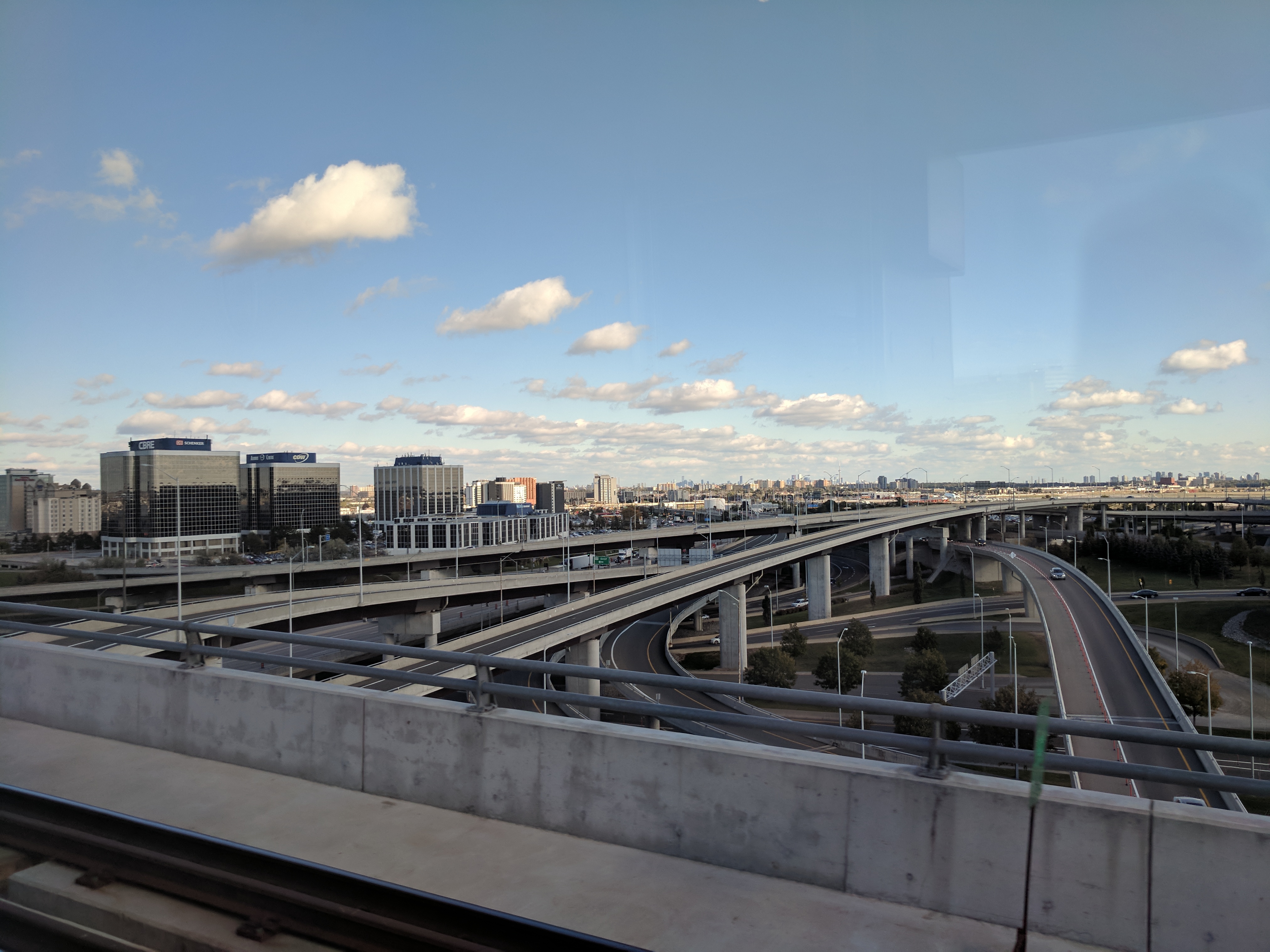 A spaghetti junction of flyovers, Toronto off in the distance.