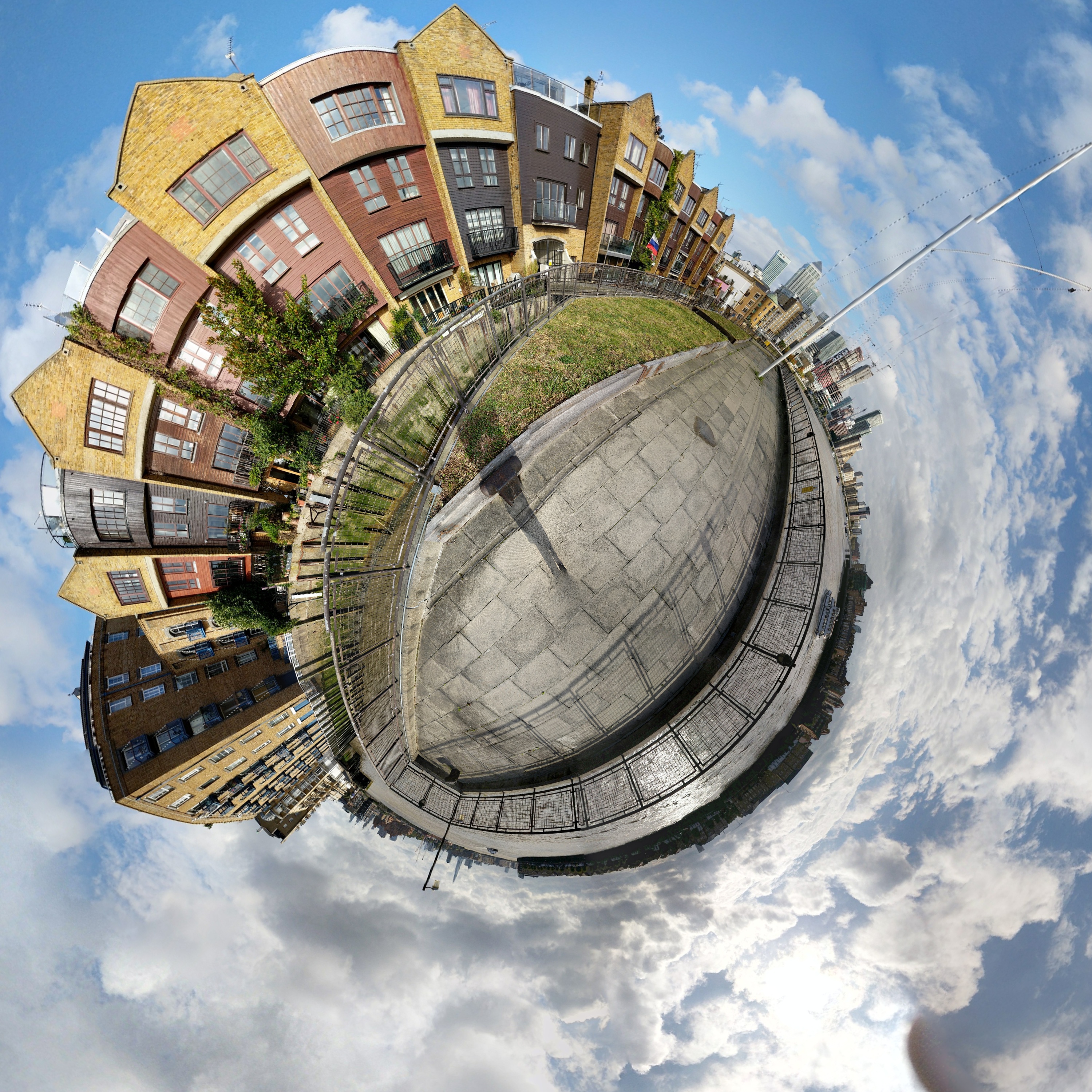 Tiny planet of tall, skinny buildings along the Thames Path.