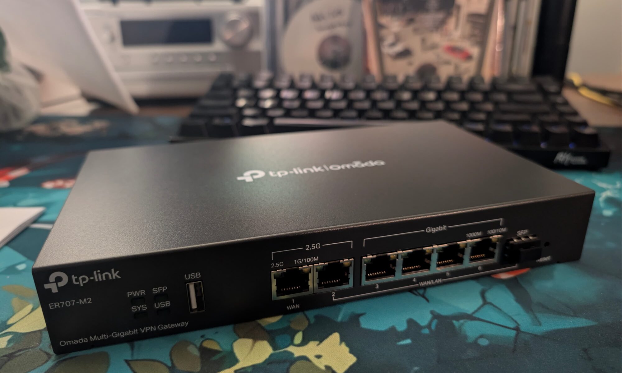 A TP-Link router sitting on the desk